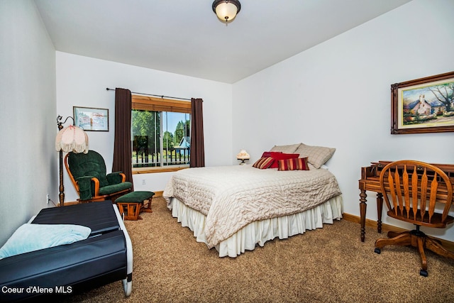 bedroom with carpet and baseboards