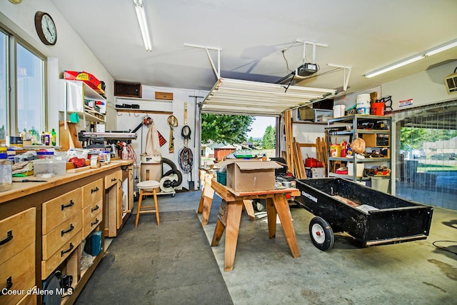 garage featuring a workshop area and a garage door opener