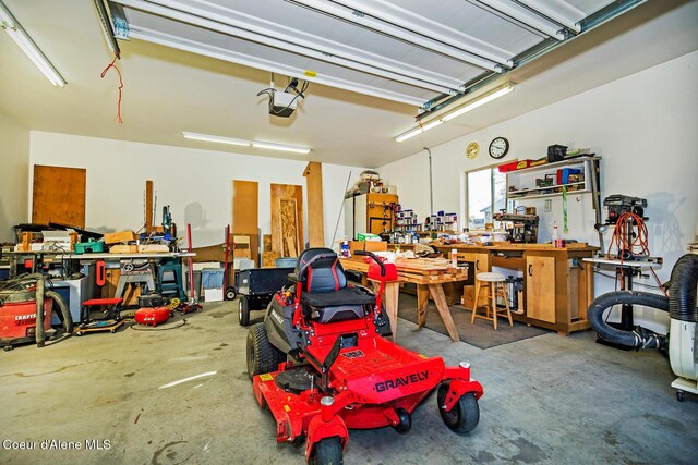 garage featuring a workshop area and a garage door opener