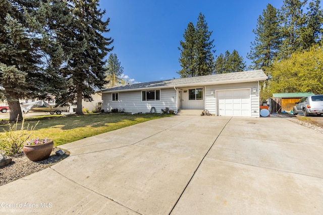 501 E 18th Ave, Post Falls, ID 83854 - single story home with a garage, a front lawn, and driveway