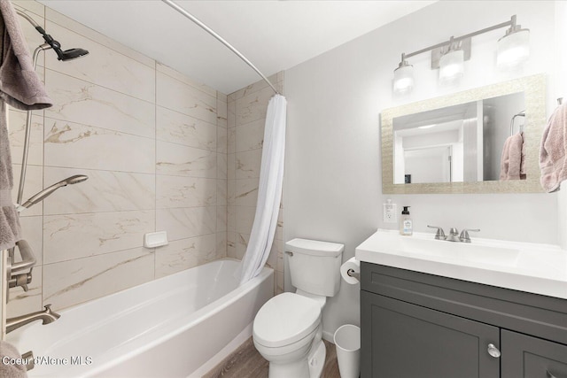 bathroom featuring vanity, wood finished floors, shower / bath combination with curtain, and toilet