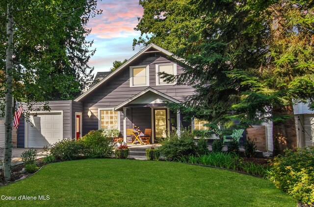 419 N Park Dr, Coeur Dalene, ID 83814 - view of front facade featuring an attached garage, a porch, and a yard