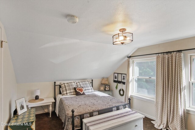 419 N Park Dr, Coeur Dalene, ID 83814 - bedroom featuring vaulted ceiling and baseboards