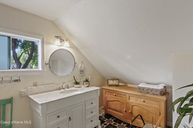419 N Park Dr, Coeur Dalene, ID 83814 - bathroom with vaulted ceiling and vanity
