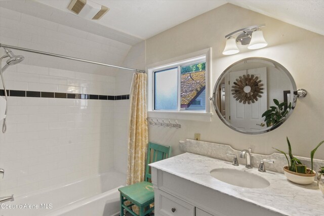 419 N Park Dr, Coeur Dalene, ID 83814 - bathroom with shower / bath combination with curtain, visible vents, vanity, and lofted ceiling