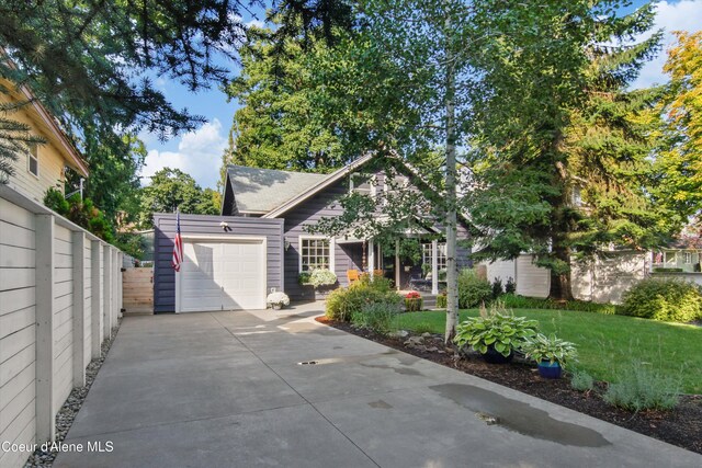 419 N Park Dr, Coeur Dalene, ID 83814 - view of front of house with an attached garage, driveway, a front yard, and fence