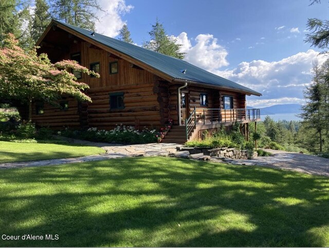 235 Larkin Ln, Sandpoint, ID 83864 - log home featuring log siding, stairway, and a front yard