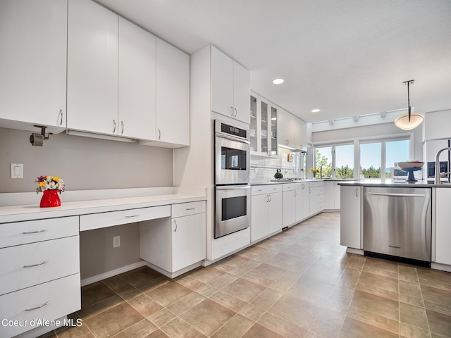255 S Theresa Terrace Dr, Post Falls, ID 83854 - kitchen with glass insert cabinets, appliances with stainless steel finishes, white cabinets, and recessed lighting