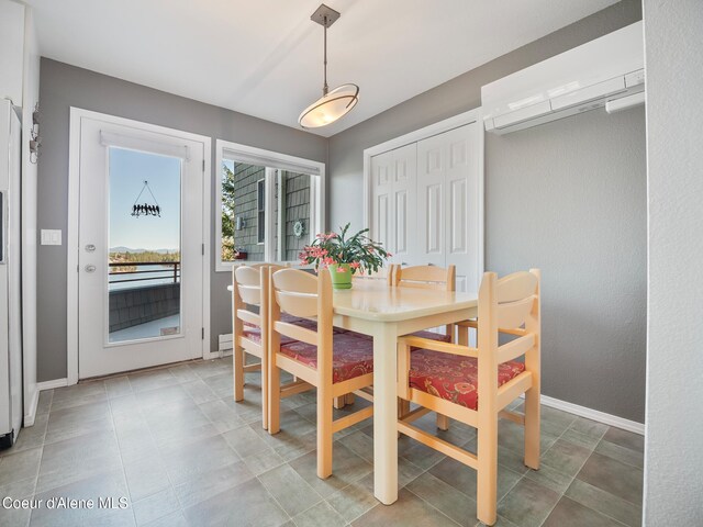 255 S Theresa Terrace Dr, Post Falls, ID 83854 - dining area featuring baseboards and a wall unit AC