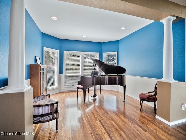 255 S Theresa Terrace Dr, Post Falls, ID 83854 - living area featuring ornate columns, baseboards, recessed lighting, and wood finished floors