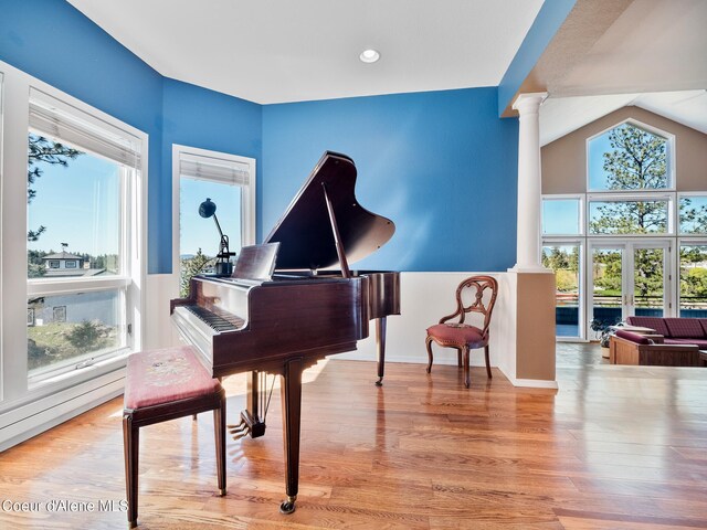 255 S Theresa Terrace Dr, Post Falls, ID 83854 - sitting room with decorative columns, wood finished floors, baseboards, recessed lighting, and vaulted ceiling