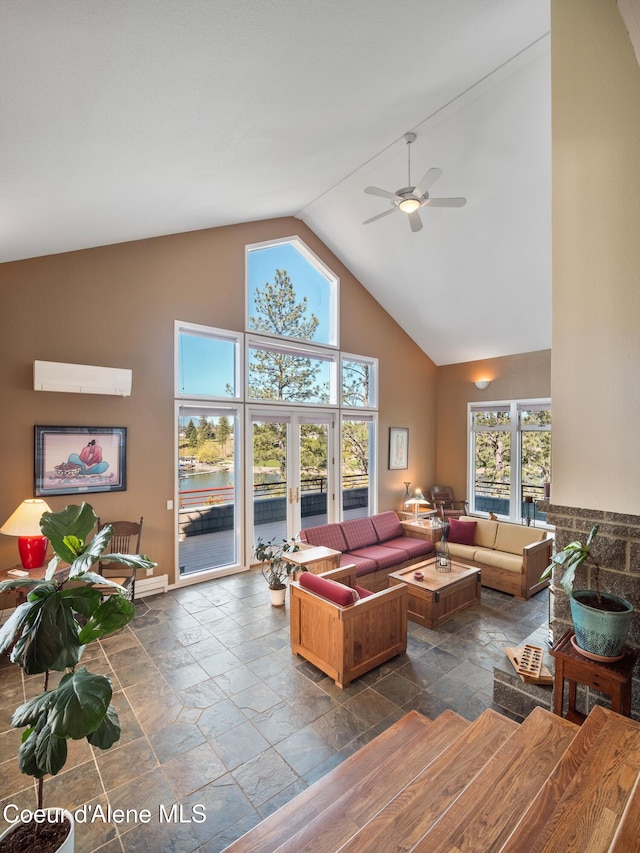 255 S Theresa Terrace Dr, Post Falls, ID 83854 - living room featuring ceiling fan, high vaulted ceiling, stone tile floors, a water view, and a wall mounted AC
