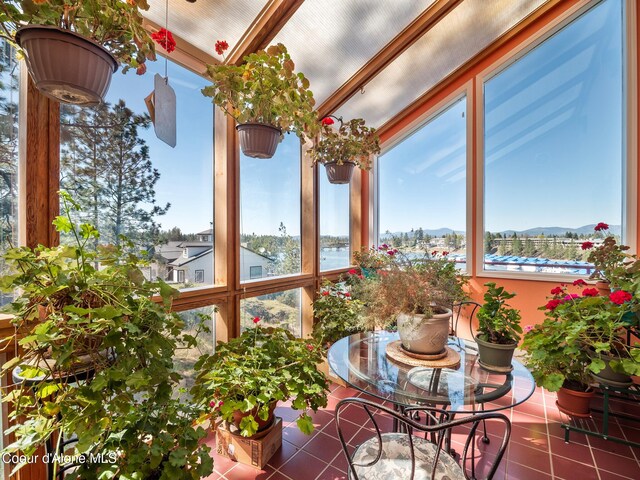 255 S Theresa Terrace Dr, Post Falls, ID 83854 - sunroom / solarium featuring tile patterned floors, a mountain view, and beam ceiling