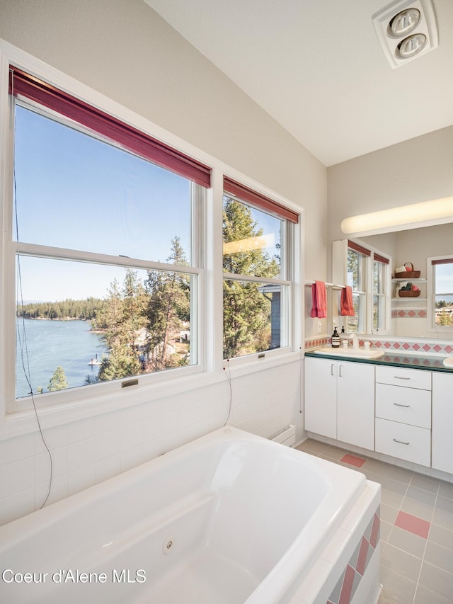 255 S Theresa Terrace Dr, Post Falls, ID 83854 - full bath featuring visible vents, tile patterned flooring, a tub with jets, vanity, and a water view
