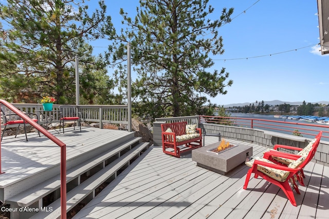 255 S Theresa Terrace Dr, Post Falls, ID 83854 - wooden terrace featuring an outdoor fire pit and a water and mountain view
