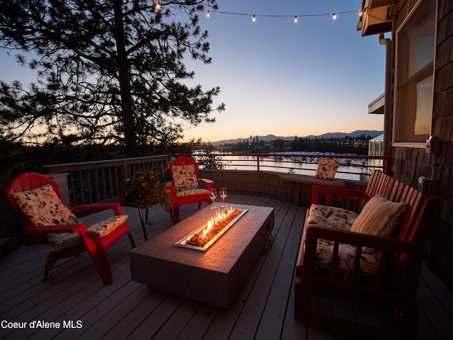 255 S Theresa Terrace Dr, Post Falls, ID 83854 - deck with a mountain view and a fire pit