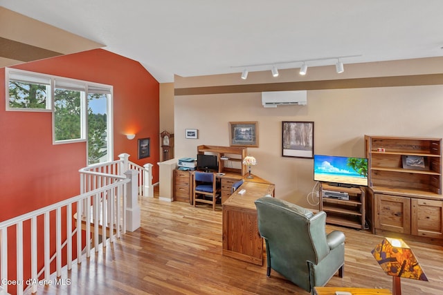 255 S Theresa Terrace Dr, Post Falls, ID 83854 - interior space with an AC wall unit, rail lighting, and wood finished floors