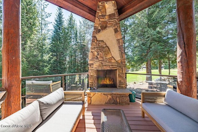 131 Long Dr, Priest Lake, ID 83856 - wooden deck with an outdoor living space with a fireplace