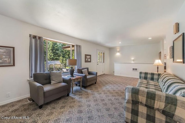 living area with carpet, baseboards, and visible vents