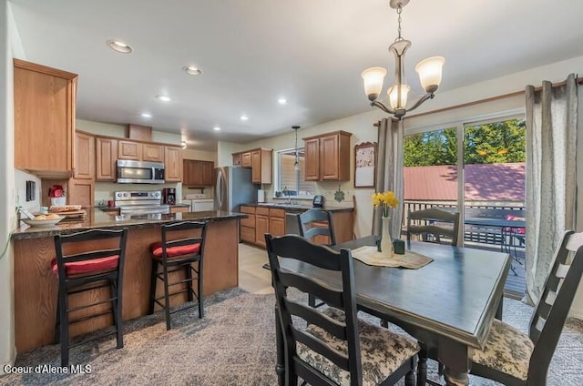dining room with an inviting chandelier and recessed lighting