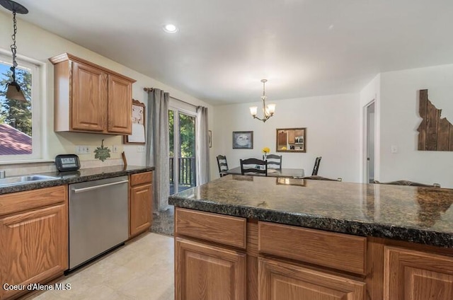 kitchen with hanging light fixtures, an inviting chandelier, stainless steel dishwasher, and brown cabinets