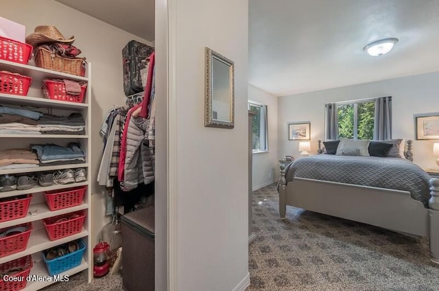 carpeted bedroom featuring baseboards