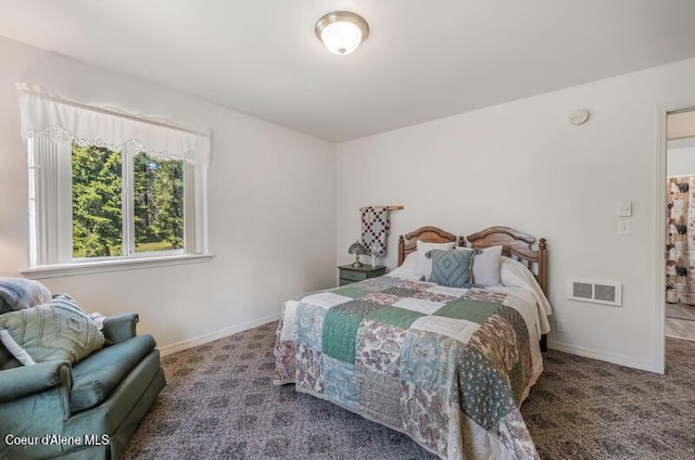 bedroom featuring baseboards, carpet flooring, and visible vents