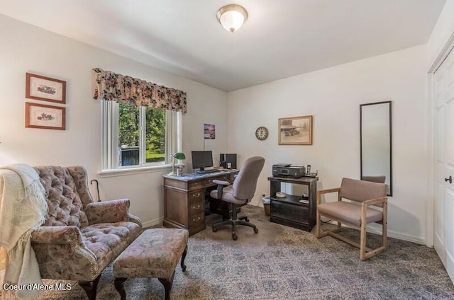 carpeted office space with baseboards