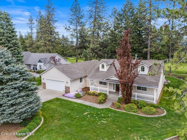 cape cod home with driveway, a porch, an attached garage, and a front yard