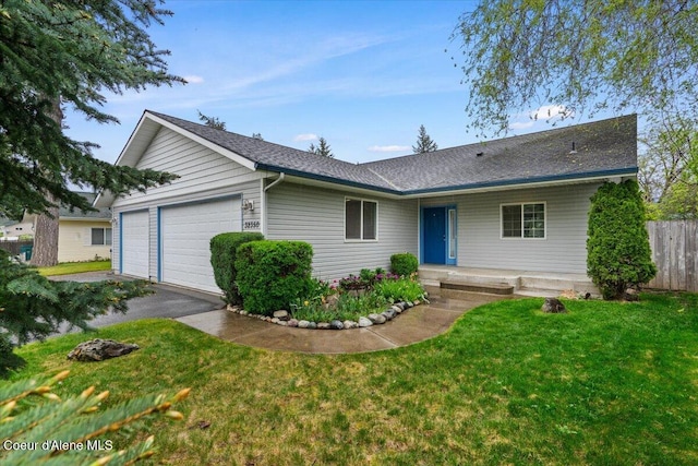 32350 N 7th Ave, Spirit Lake, ID 83869 - single story home with a garage, a shingled roof, and driveway