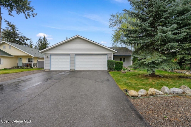 32350 N 7th Ave, Spirit Lake, ID 83869 - ranch-style house with asphalt driveway, a front lawn, and a garage