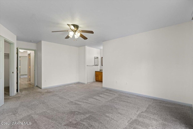 32350 N 7th Ave, Spirit Lake, ID 83869 - unfurnished living room with ceiling fan, light carpet, and baseboards