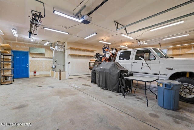 32350 N 7th Ave, Spirit Lake, ID 83869 - garage featuring a garage door opener and heating unit