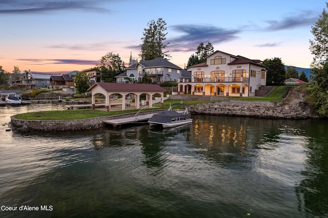 1100 S Division Ave, Sandpoint, ID 83864 - back of property with a yard, a water view, and a balcony