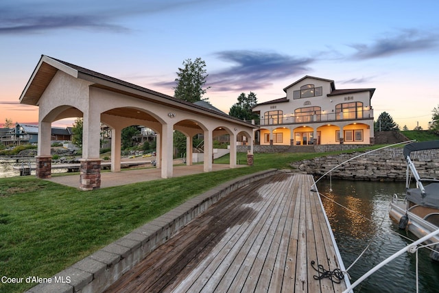 1100 S Division Ave, Sandpoint, ID 83864 - exterior space with a balcony, a yard, and a water view