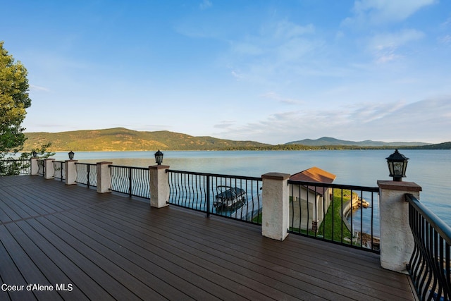 1100 S Division Ave, Sandpoint, ID 83864 - wooden terrace with a water and mountain view