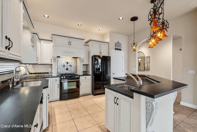 1100 S Division Ave, Sandpoint, ID 83864 - kitchen featuring black appliances, dark countertops, a sink, and light tile patterned floors