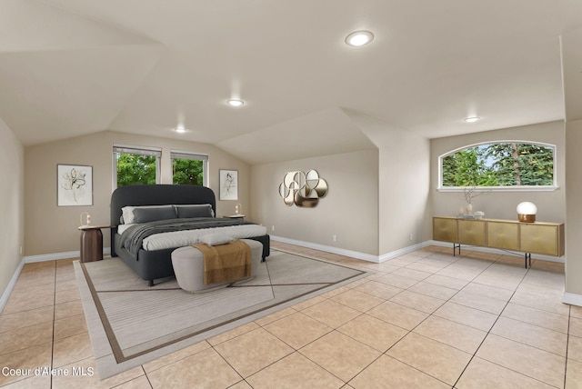 1100 S Division Ave, Sandpoint, ID 83864 - bedroom with vaulted ceiling, baseboards, recessed lighting, and light tile patterned floors