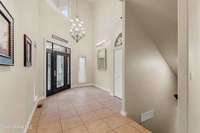 1100 S Division Ave, Sandpoint, ID 83864 - foyer entrance with baseboards, an inviting chandelier, visible vents, and light tile patterned floors