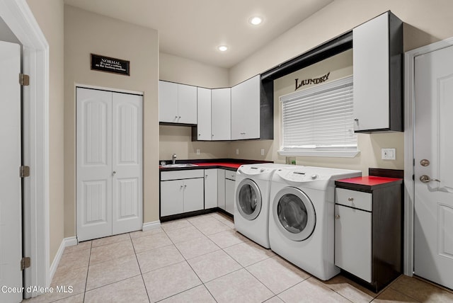1100 S Division Ave, Sandpoint, ID 83864 - clothes washing area featuring recessed lighting, washer and clothes dryer, a sink, light tile patterned flooring, and cabinet space