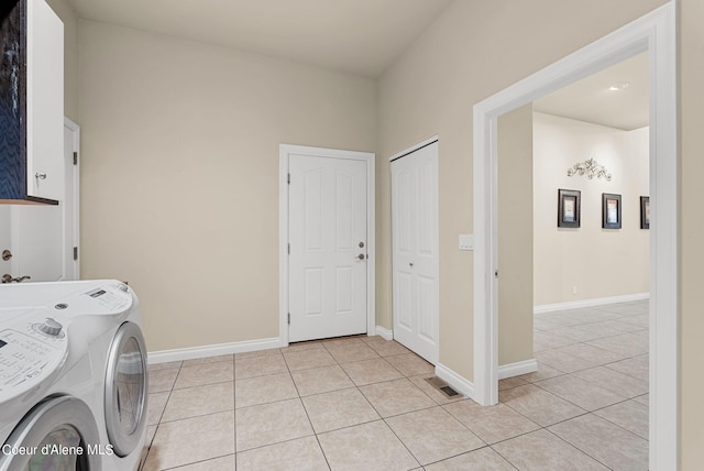 1100 S Division Ave, Sandpoint, ID 83864 - clothes washing area with separate washer and dryer, baseboards, light tile patterned floors, and cabinet space
