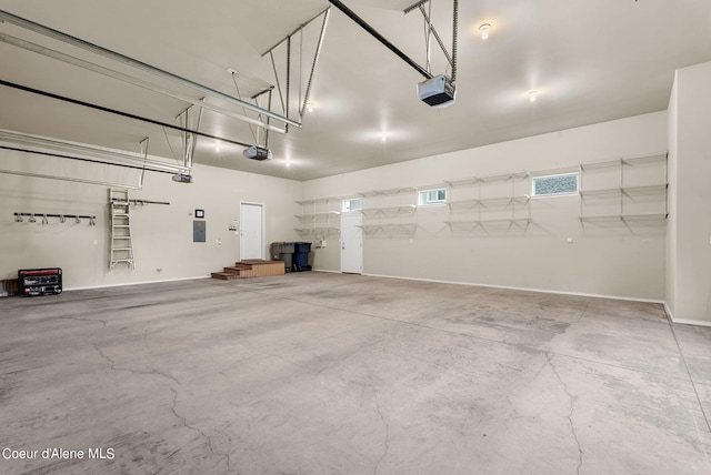 1100 S Division Ave, Sandpoint, ID 83864 - garage with baseboards and a garage door opener