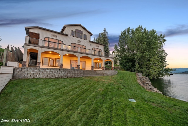 1100 S Division Ave, Sandpoint, ID 83864 - rear view of property featuring a yard, a water view, and a balcony