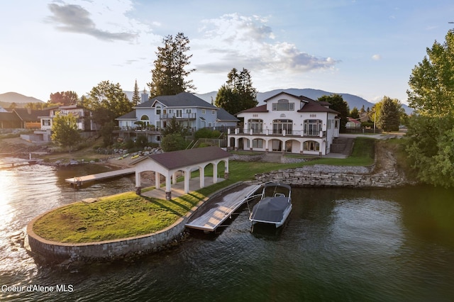 1100 S Division Ave, Sandpoint, ID 83864 - rear view of house with a lawn, a balcony, a gazebo, and a water view