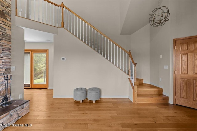 3677 S Capeview Ct, Coeur Dalene, ID 83814 - foyer featuring wood finished floors, baseboards, a high ceiling, and stairway