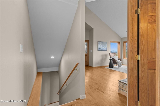 3677 S Capeview Ct, Coeur Dalene, ID 83814 - stairway with baseboards, vaulted ceiling, recessed lighting, and wood finished floors