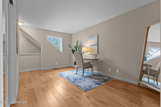 3677 S Capeview Ct, Coeur Dalene, ID 83814 - home office with light wood-style floors, baseboards, and a wealth of natural light