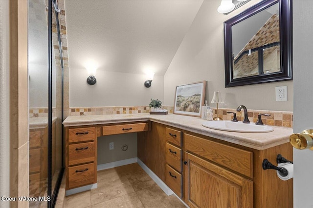 3677 S Capeview Ct, Coeur Dalene, ID 83814 - full bath featuring tile patterned floors, tasteful backsplash, lofted ceiling, and vanity