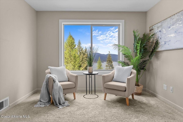 3677 S Capeview Ct, Coeur Dalene, ID 83814 - sitting room with visible vents, baseboards, carpet floors, and a mountain view