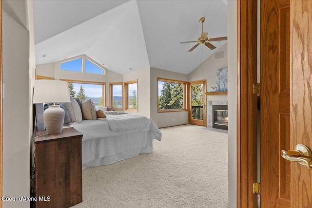3677 S Capeview Ct, Coeur Dalene, ID 83814 - bedroom featuring carpet floors, multiple windows, a fireplace, and vaulted ceiling